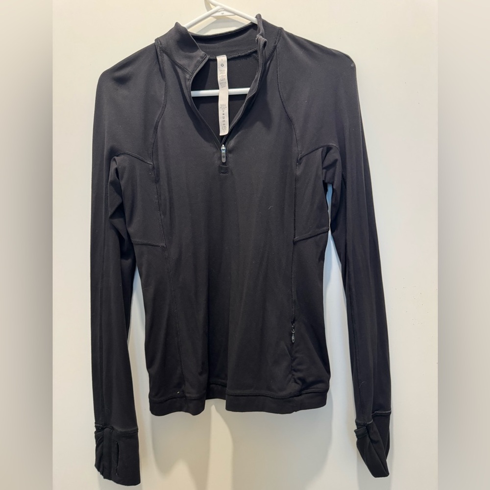 It’s rulu run half zip. Black size 6